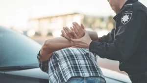 person being arrested by a police officer facing the consequences of an ovi dui charge