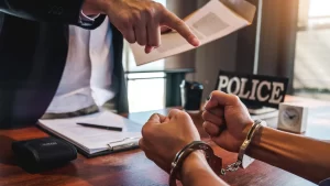 person with handcuff and attorney