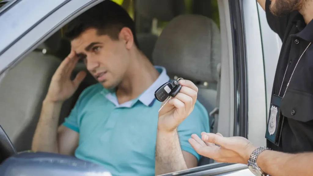 Driver showing keys to an officer during a traffic stop